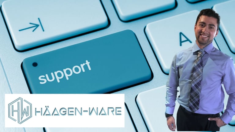 Professional man in business attire standing next to large keyboard key labeled support with Haagen-Ware logo